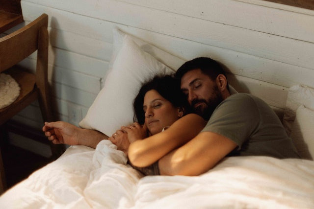 Couple Sleeping in Bed